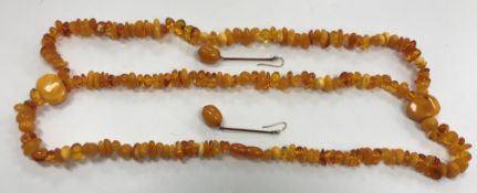 A pair of amber bead drop earrings with yellow metal mounts, total weight 4.7 g, beads approx.