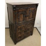 A 20th Century oak cupboard in the 17th Century style,