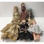 An early 20th Century doll with painted face in 18th Century style clothing,