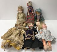 An early 20th Century doll with painted face in 18th Century style clothing,