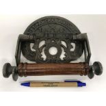 A collection of four modern cast metal toilet roll holders, one inscribed "Great Western Railway",