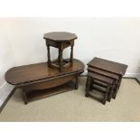 A modern oak nest of three occasional tables in the 17th Century style 55 cm x 35 cm x 47.