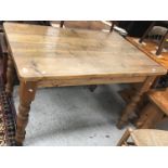 A modern pine farmhouse style kitchen table,
