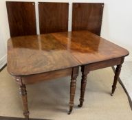 A 19th Century mahogany dining table, the rounded rectangular top with three extra leaves,
