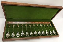 A modern cased set of twelve silver Royal Horticultural Society flower teaspoons in a presentation
