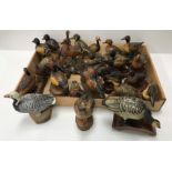 A collection of 23 various hand-painted wood carved or plaster figures of ornamental ducks,