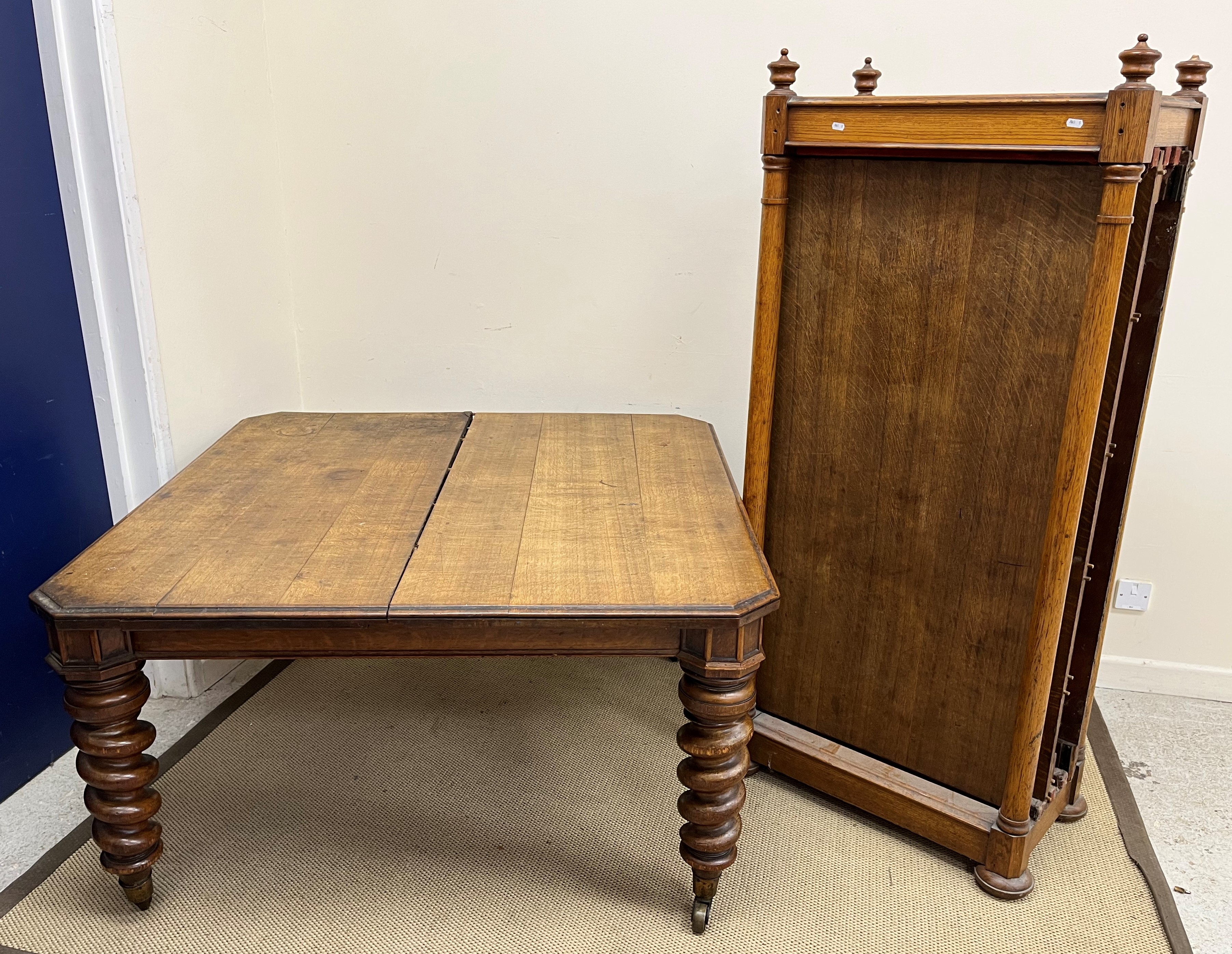 A Victorian oak extending dining table,