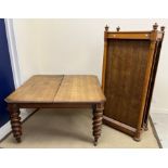 A Victorian oak extending dining table,