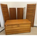 A modern teak Ladderax cabinet with wooden sides,