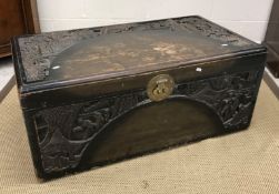 A stained and carved camphor wood trunk 100 cm wide x 41 cm deep x 55 cm high,