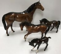 A collection of four Beswick horse figures including large racehorse 36 cm long x 29.