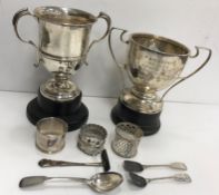 A collection of silver wares comprising two twin-handled trophy cups,