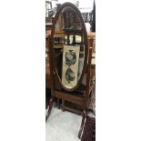 An Edwardian mahogany and inlaid oval cheval mirror on square tapered supports to splayed feet and