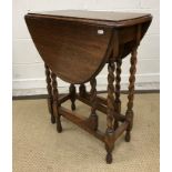 A circa 1900 stained beech piano stool with fall front music compartment,