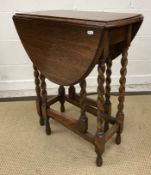 A circa 1900 stained beech piano stool with fall front music compartment,