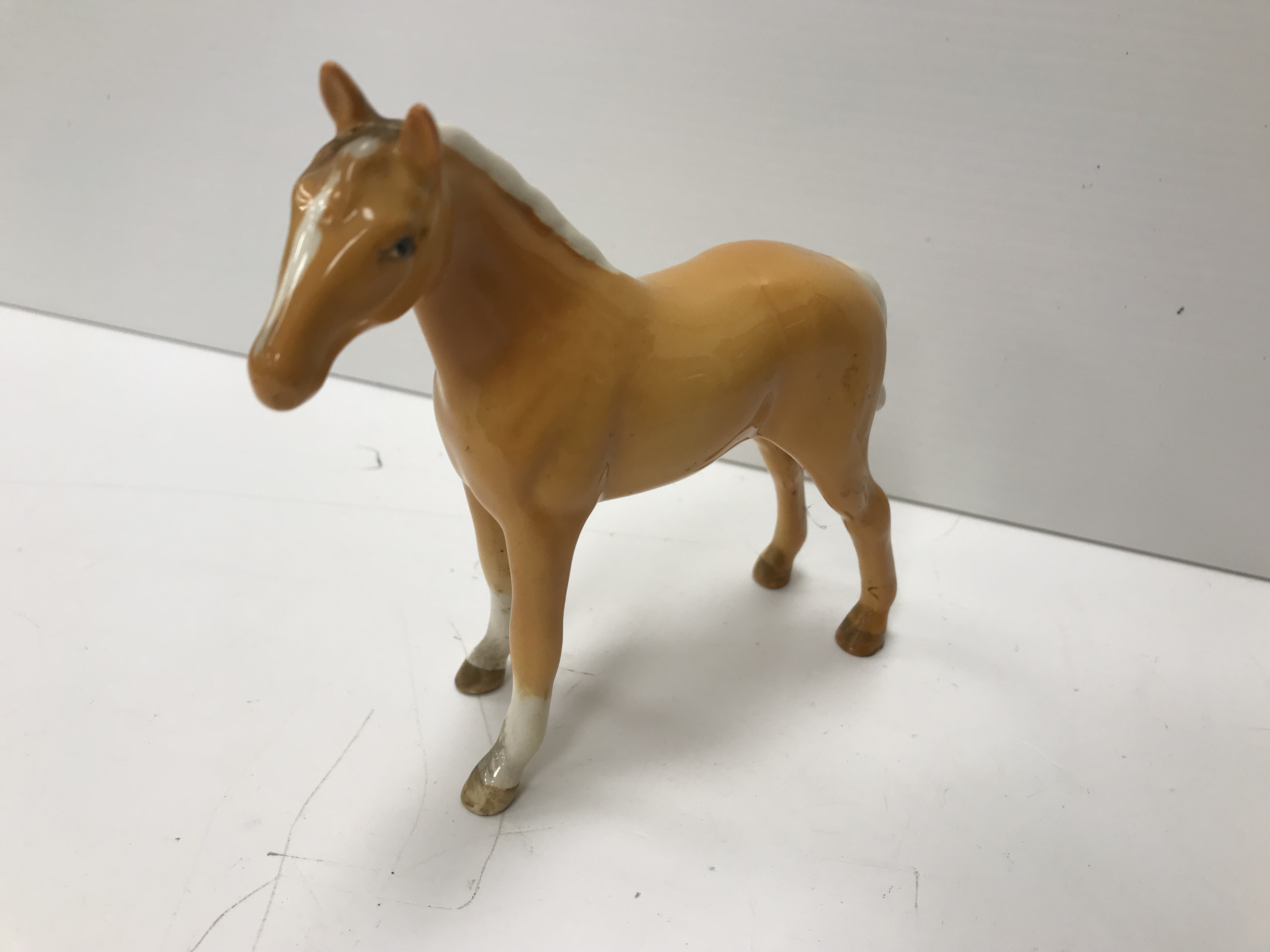 A collection of four Beswick Palomino horse figures together with three Palomino foal figures, - Image 13 of 44