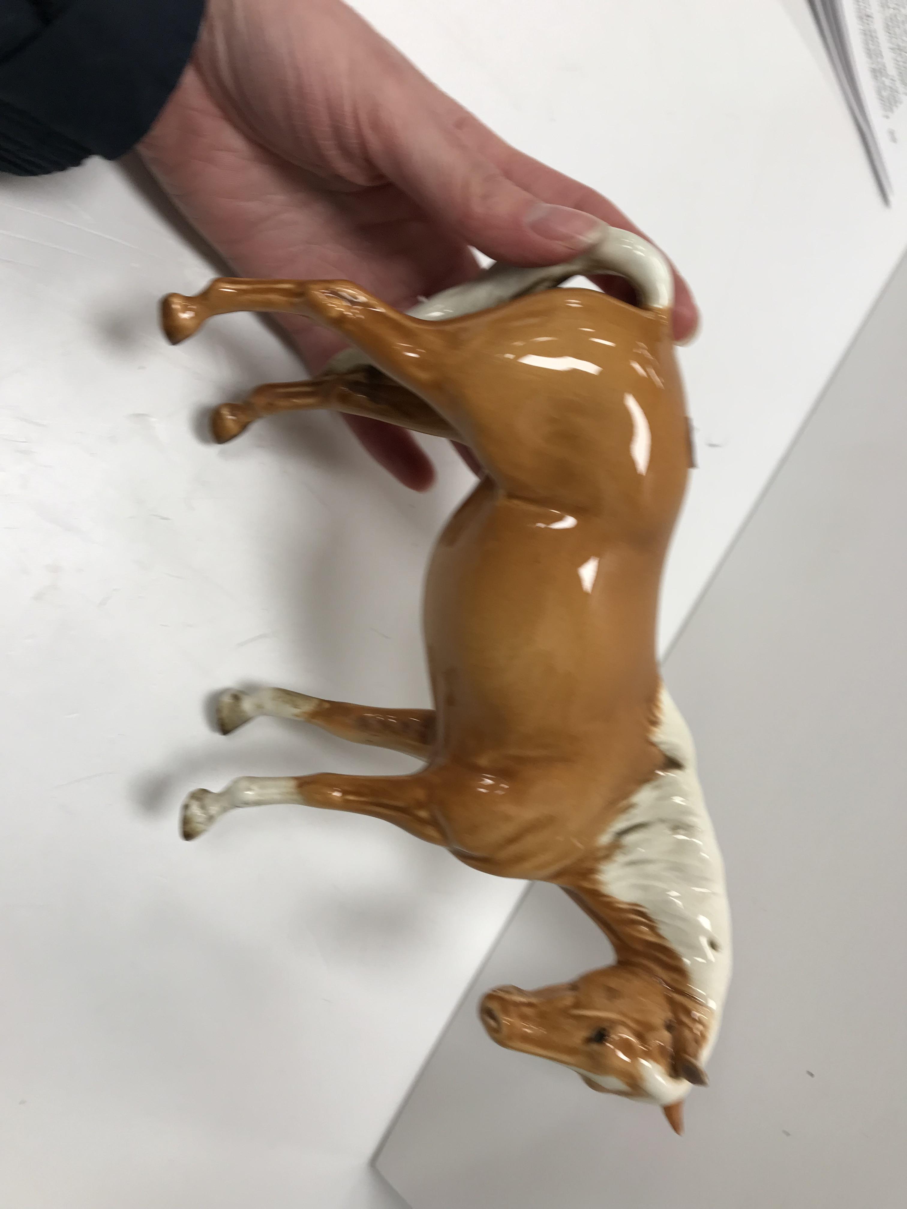 A collection of four Beswick Palomino horse figures together with three Palomino foal figures, - Image 38 of 44