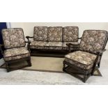 An Ercol elm framed three piece cottage living room suite comprising sofa and two armchairs 160 cm