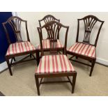 A set of ten circa 1900 Hepplewhite design dining chairs with pierced and lotus leaf carved back