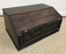 A 18th Century oak Bible box, the plain top above a sloping fall enclosing a single drawer,