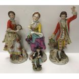A pair of Sitzendorf porcelain figures in 18th Century dress each with a lamb at their feet,