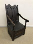 An 18th Century oak lambing chair,