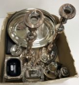 A box of assorted plated wares to include a pair of 19th Century plated and copper candlesticks in