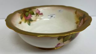 A Royal Worcester porcelain bowl with handpainted rose decoration and gilt highlighting,