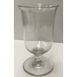 A 19th Century plain glass celery glass of inverted bell form raised on a plain waisted stem to