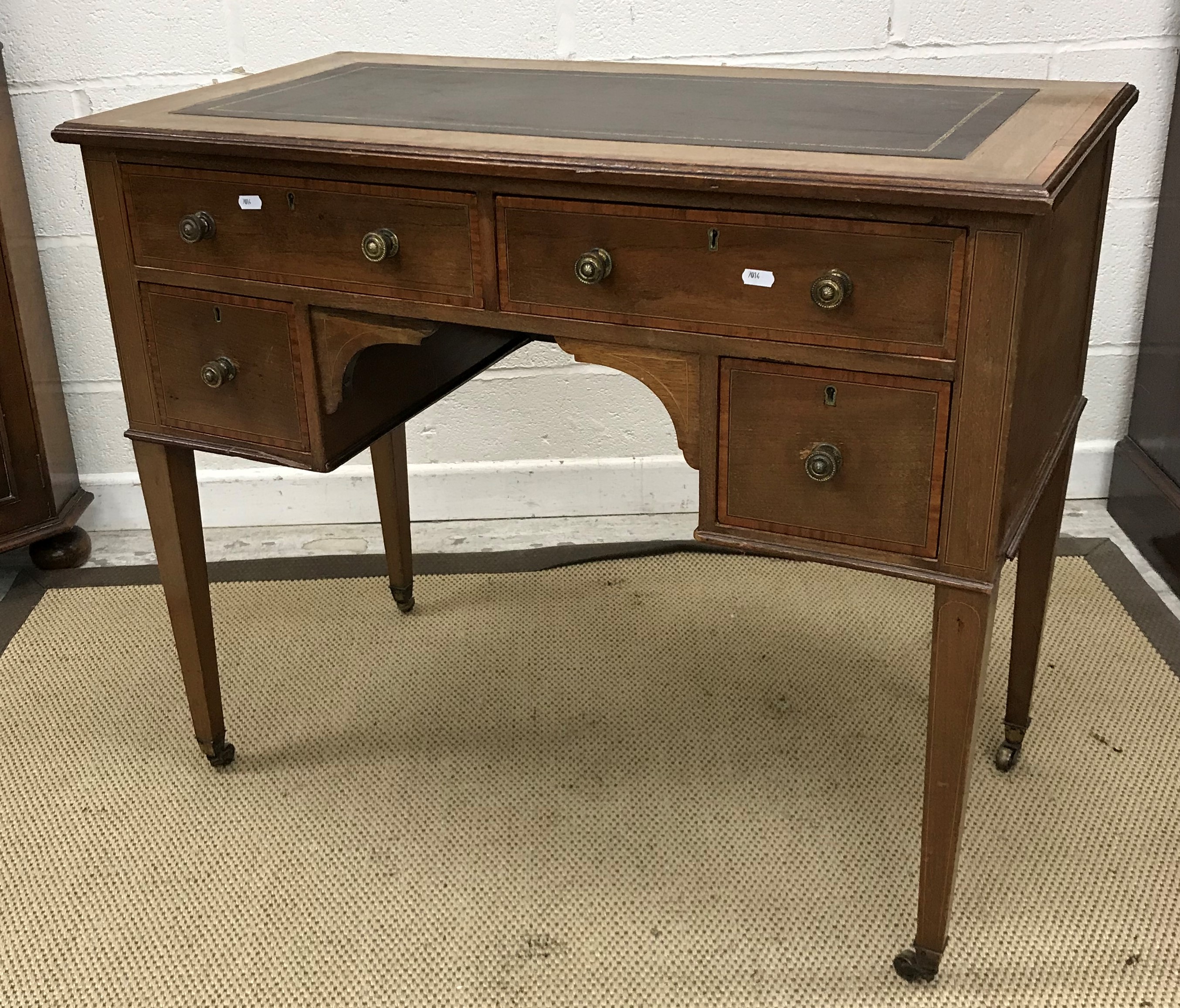 An Edwardian mahogany and satinwood banded Sheraton Revival writing table,