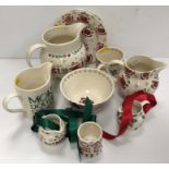 A collection of Emma Bridgwater Christmas pottery including two jugs,