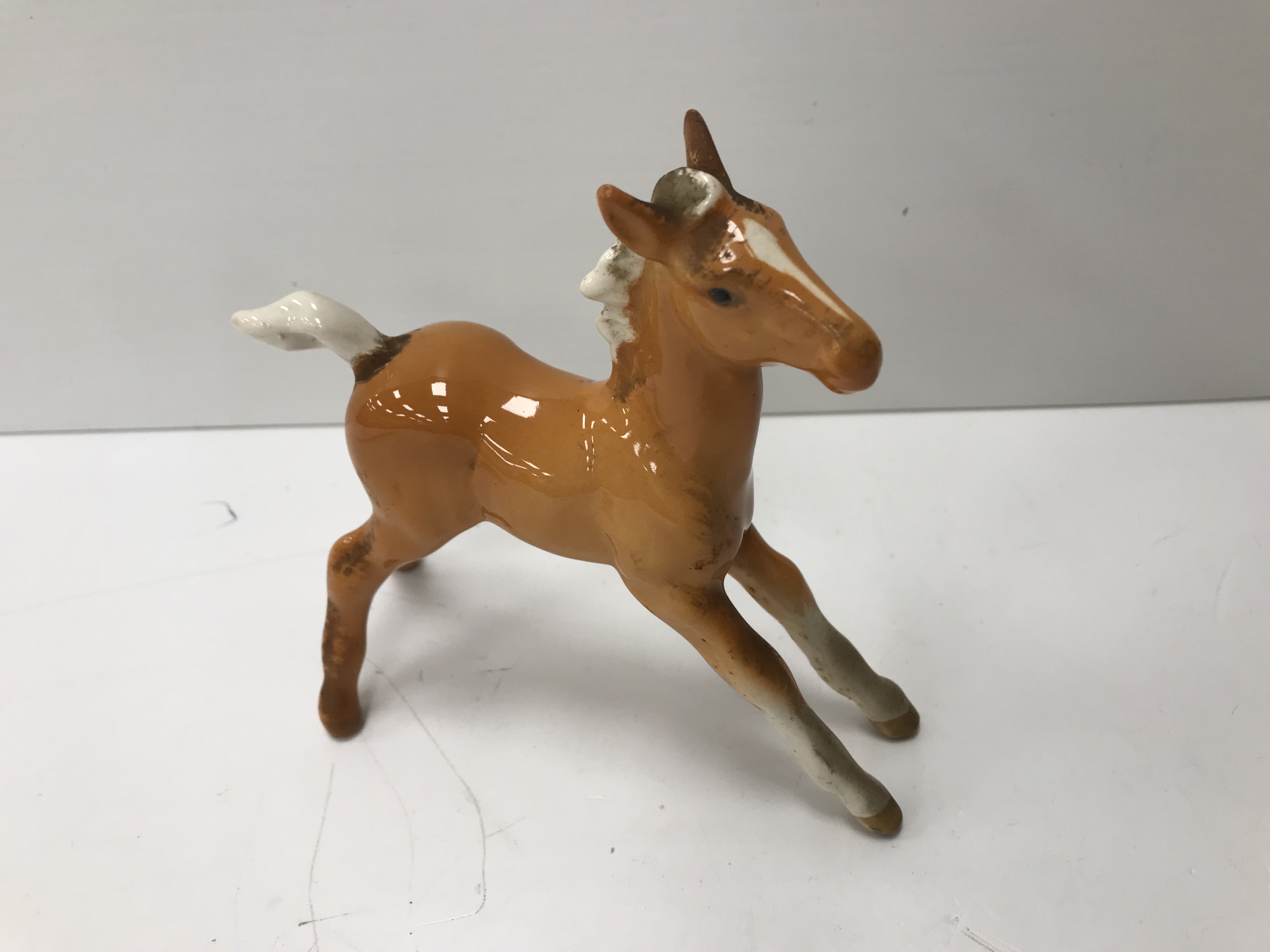 A collection of four Beswick Palomino horse figures together with three Palomino foal figures, - Image 18 of 44