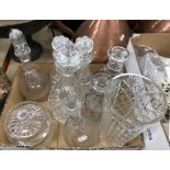 A collection of various cut glass ware including three fruit bowls, seven decanters,