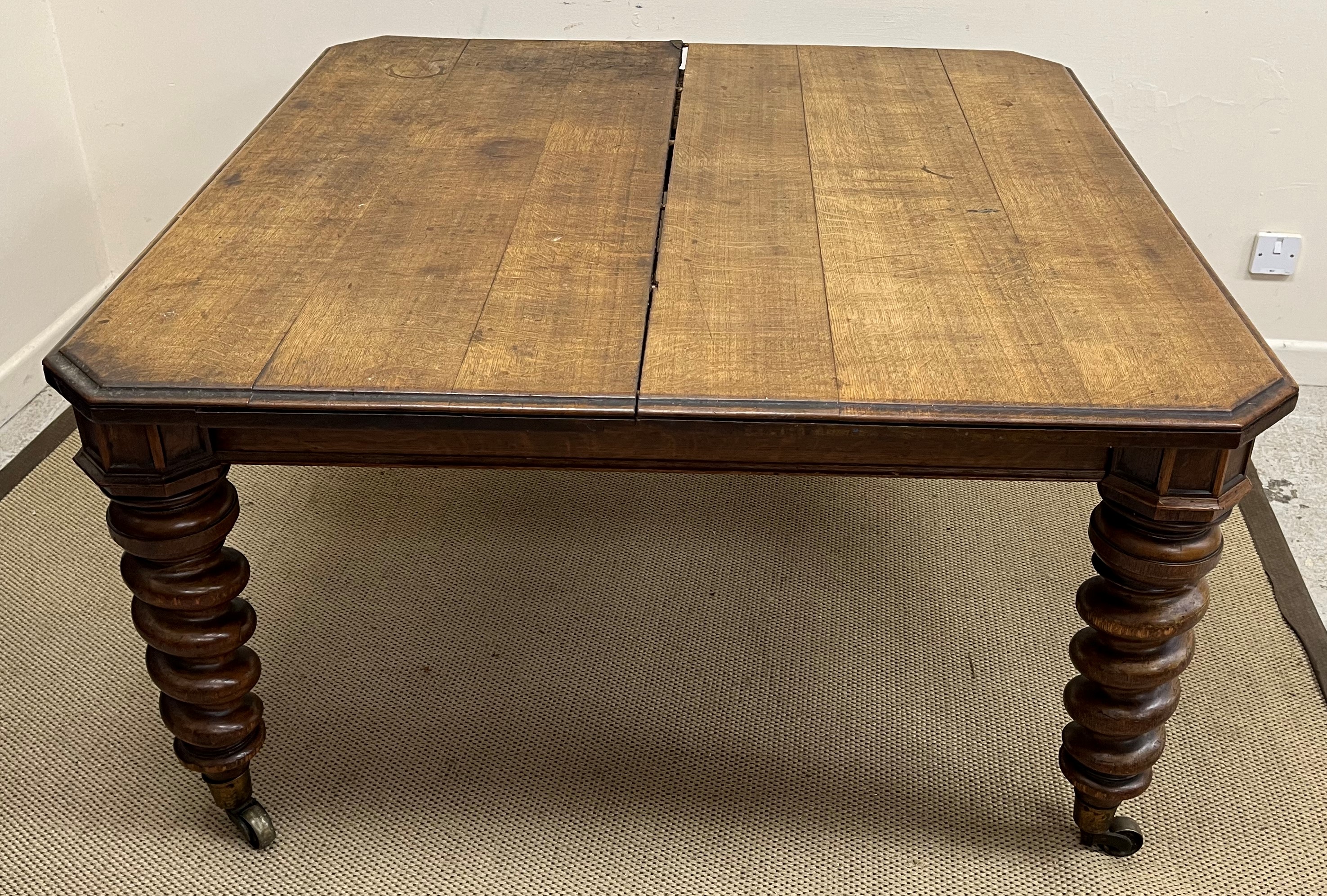 A Victorian oak extending dining table, - Image 3 of 5
