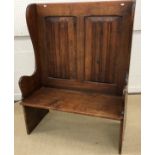 A 20th Century oak settle,