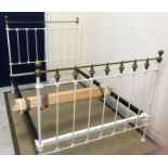 A late Victorian white painted iron and brass bedstead,