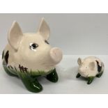 A Griselda Hill Pottery Wemyss black hen and cockerel pattern medium sized pig figure 31 cm long x