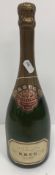One bottle Krug Grande Cuvée Champagne, white or pale yellow label,