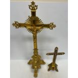 A 19th Century gilt brass altar crucifix raised on three heavy lion's paw feet 61.