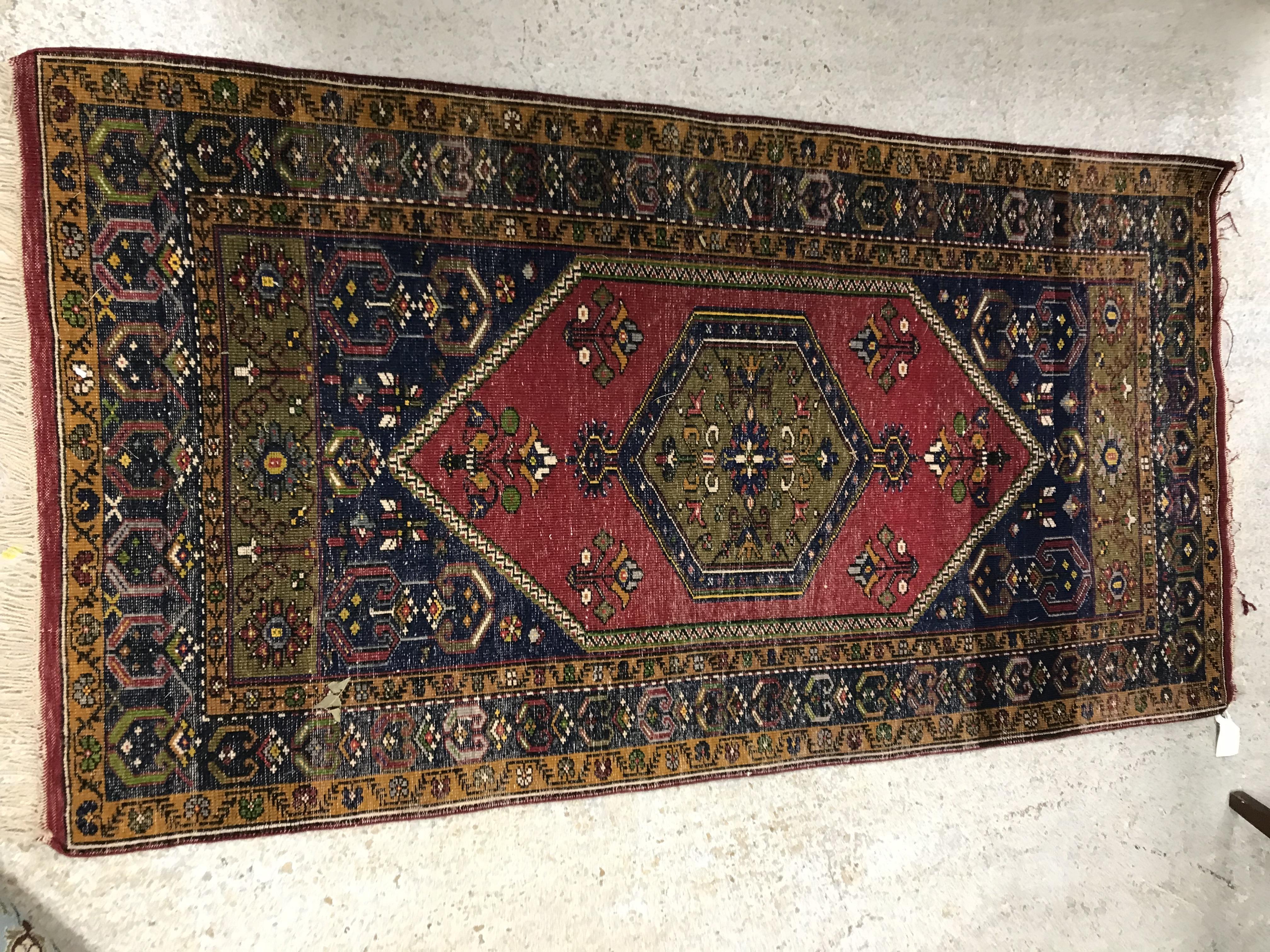 A Caucasian rug, the central panel set with lozenge shaped medallion on a red and blue ground, - Image 2 of 3