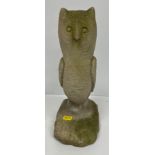 A 20th Century carved natural stone figure of a seated owl in the Arts and Crafts style 33 cm high