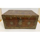 An Indian teak brass bound and studded trunk of rectangular form,