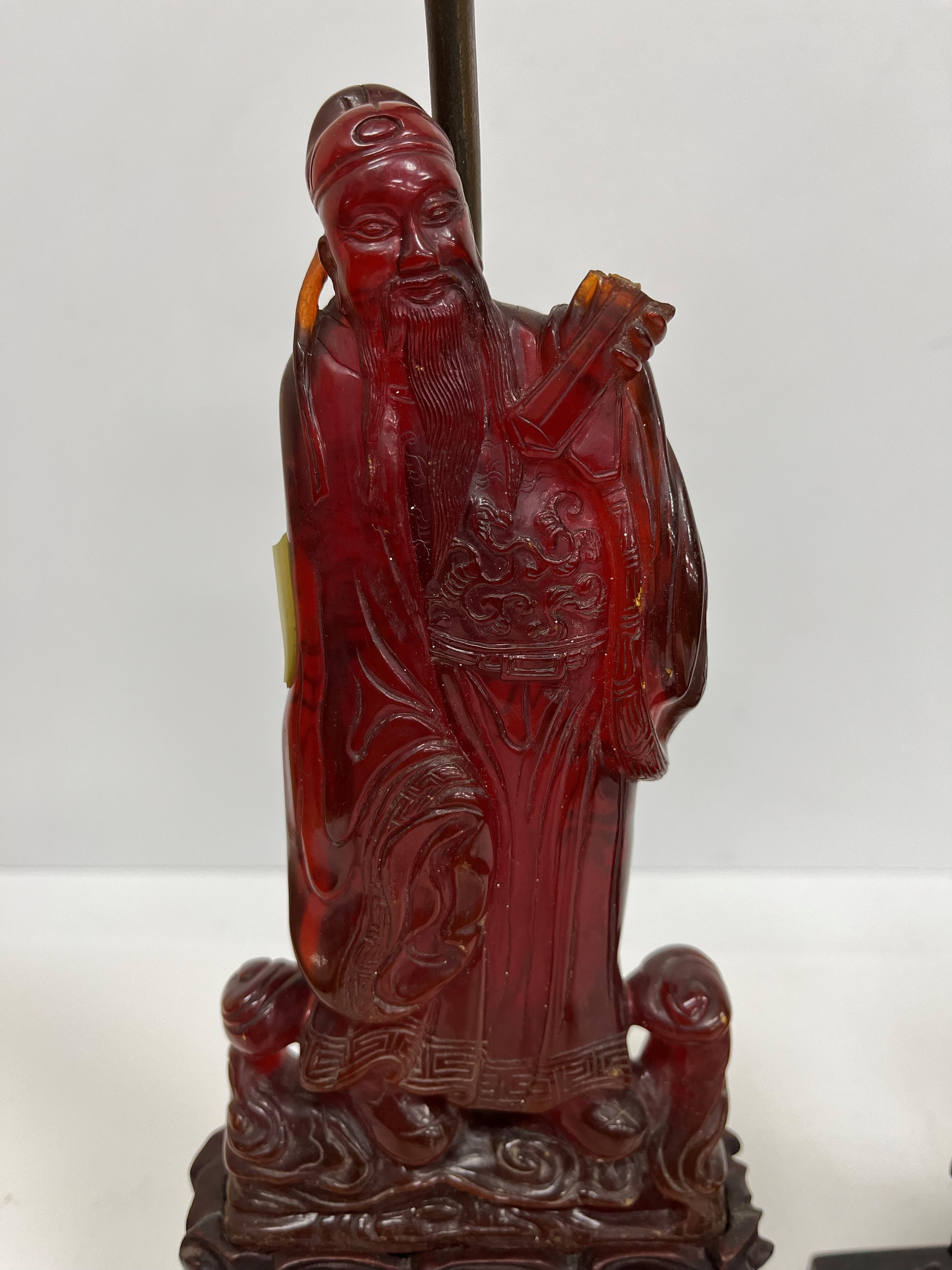 A pair of Chinese carved amber figures of a man and a woman in robes, - Image 2 of 27