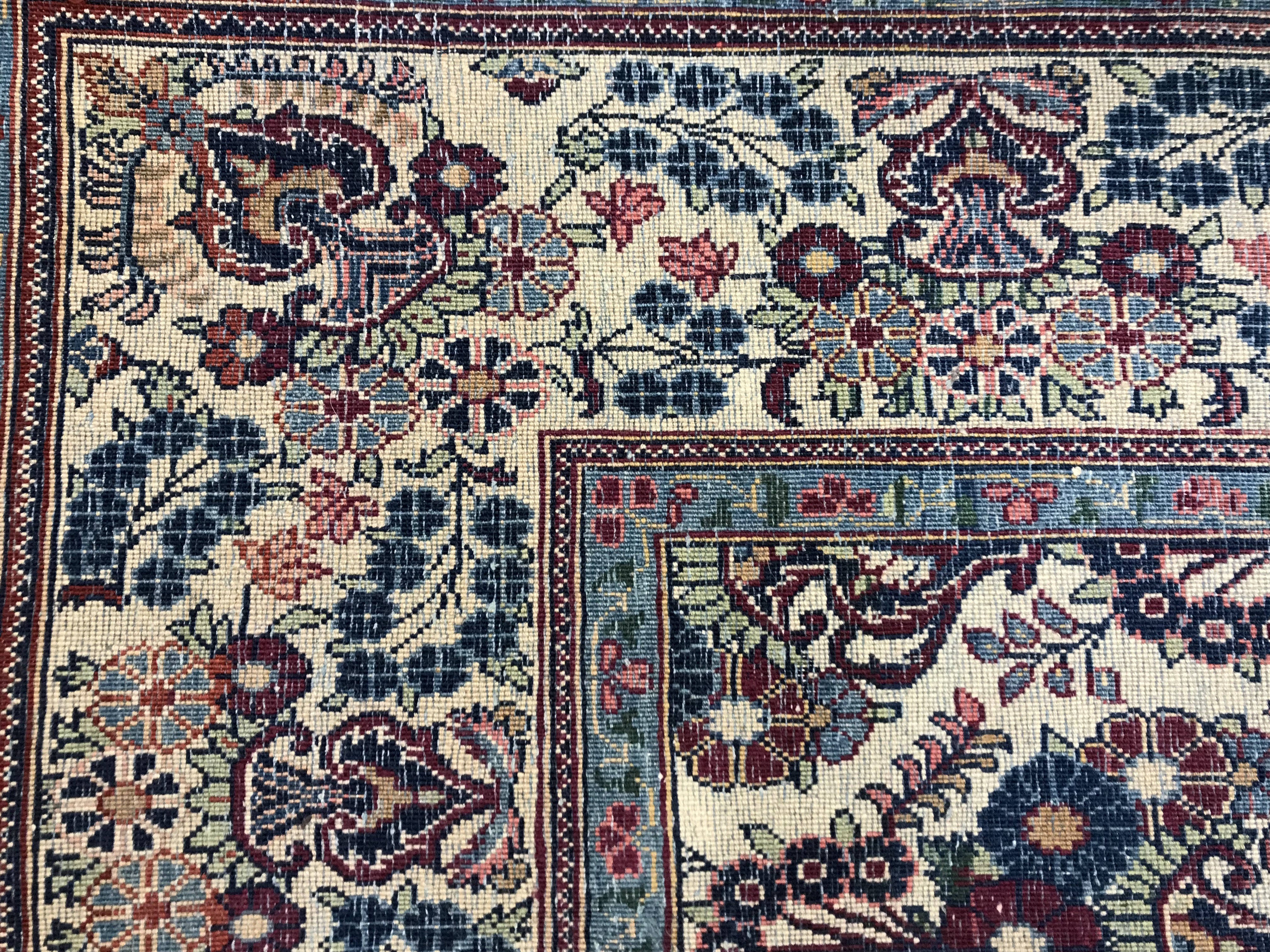 A pair of Persian rugs, the central panel set with repeating floral motifs on a cream ground, - Image 16 of 18