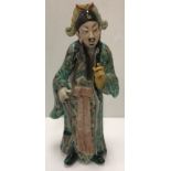 A 19th Century Chinese famille verte figure of a gentleman in floral decorated robes with remnants