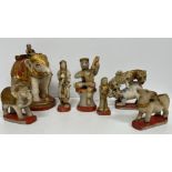 A collection of seven Indian carved alabaster painted and gilded figures including elephant and