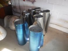 A collection of eight aeronautical steel exhaust pipes,