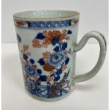 A 19th Century Chinese Imari mug of cylindrical form decorated with flowers and fence with remnants