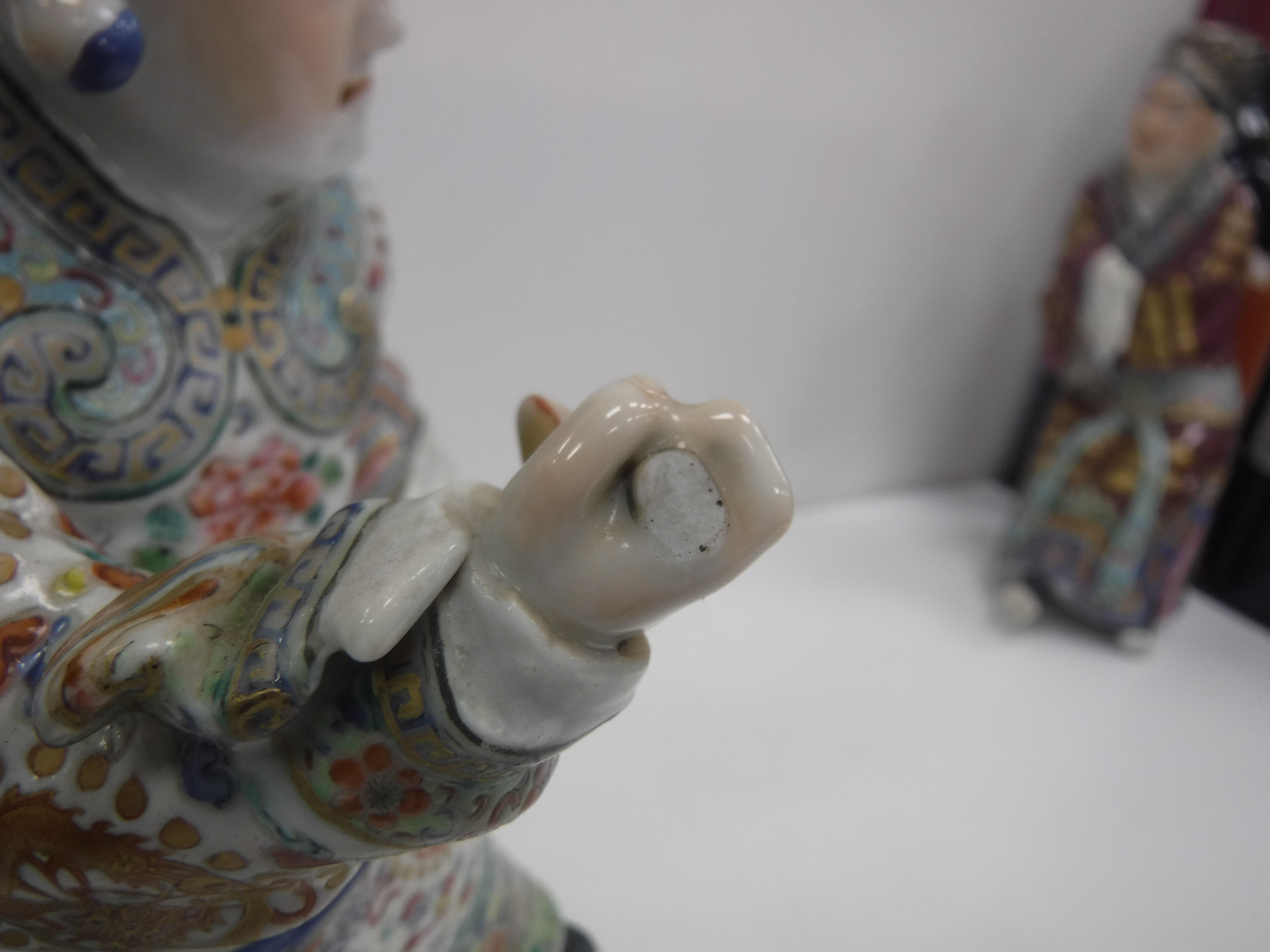 A set of three 19th Century Chinese polychrome decorated figures, one seated, one bearing sword, - Image 24 of 37