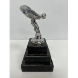 A modern chrome plated figure of the Spirit of Ecstasy on a stepped black stone base 12.